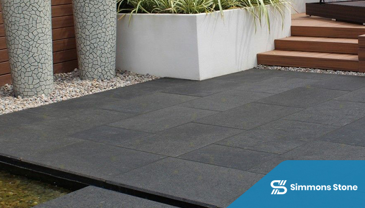 Large-format granite pavers in a residential walkway