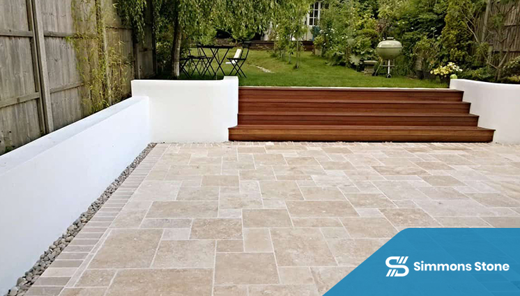 Travertine pavers installed in a backyard in a residential setup