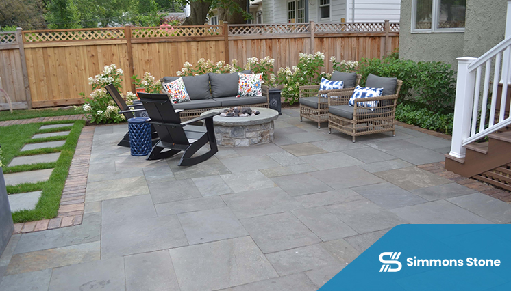 Paver patio with cozy seating and built-in firepit