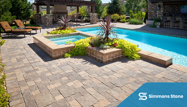 Elegant poolside patio with benches, pavers, garden fountain and shrubs