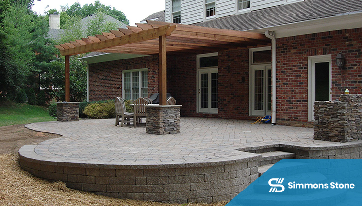 Front yard paver patio with pergola and comfortable seating