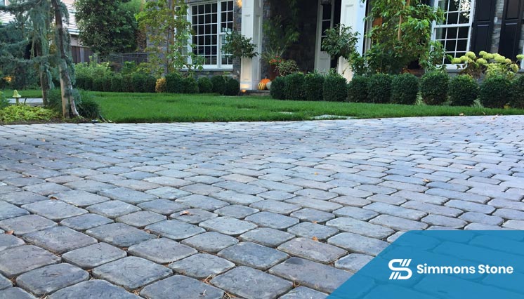 Stone paver driveway in a landscaped garden