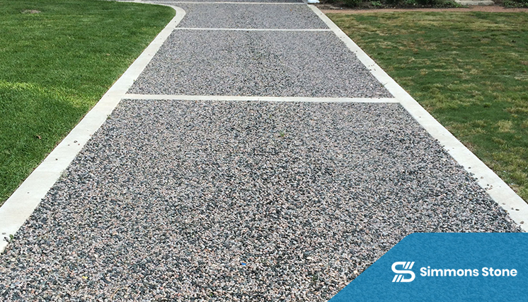 Pea gravel driveway in residential setting with tidy borders