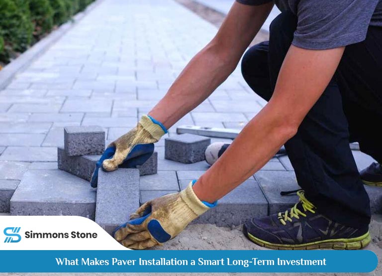 Paver driveway installation by worker for boosting home value and aesthetics