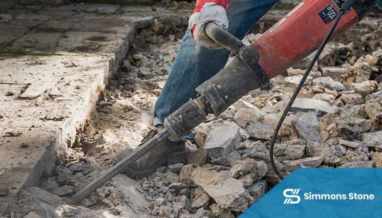 Old paver stones being removed for recycling or disposal