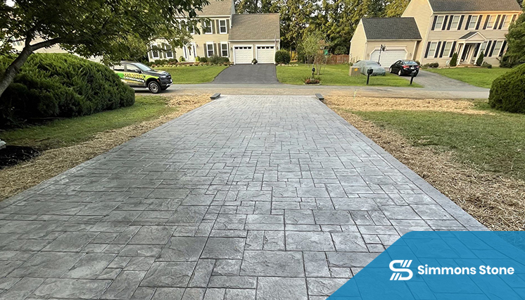 Freshly installed stamped concrete driveway with ashlar slate pattern