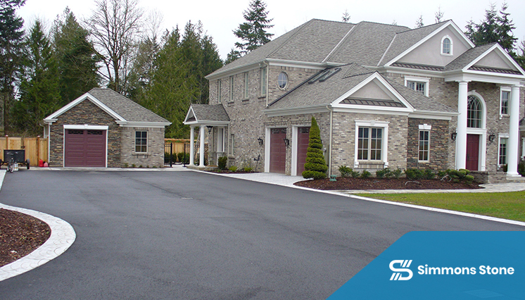 Sealant being evenly applied in a driveway