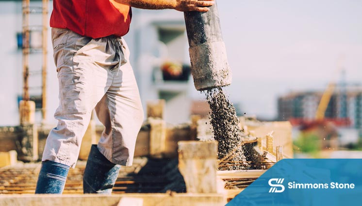 Workers preparing concrete slab foundation