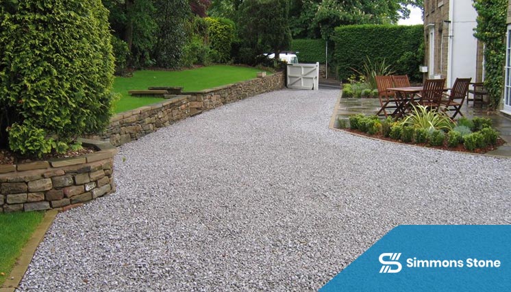 Fresh gravel being added to a driveway surface